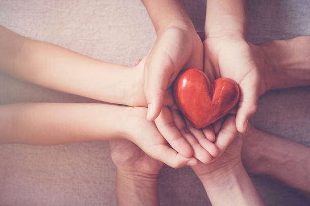 hands holding red heart, health insurance, donation concept - Фото, зображення