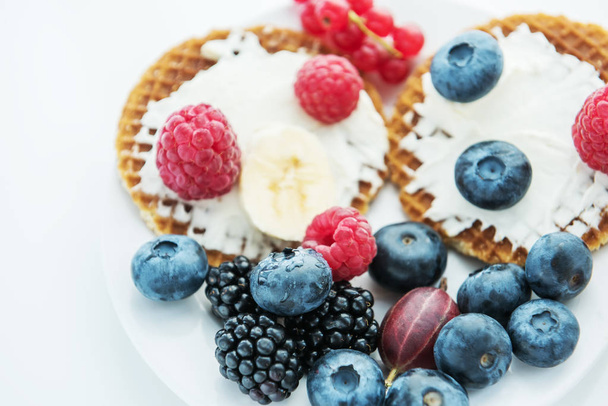 Waffles and various fresh berries and fruits. Healthy tasty breakfast, snack. Very soft selective focus. - Fotoğraf, Görsel