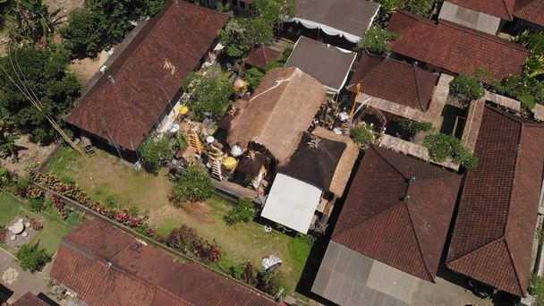 4K aerial view of traditional balinese houses. Flying over balinese village. Bali island. - Photo, Image