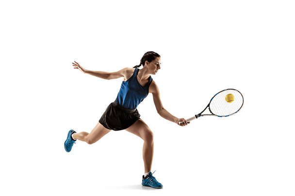 Full length portrait of young woman playing tennis isolated on white background - Fotoğraf, Görsel