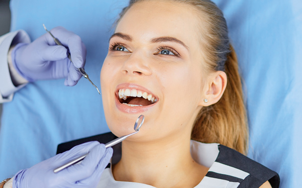beautiful girl in the dental chair on the examination at the de - Photo, Image
