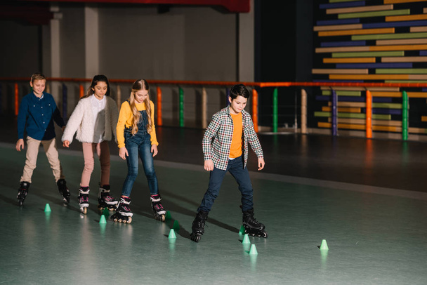 Full length shot of kids in roller skates training together - Valokuva, kuva