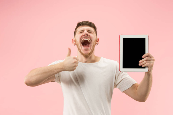 portrait of smiling man pointing at laptop with blank screen isolated on white - Foto, afbeelding