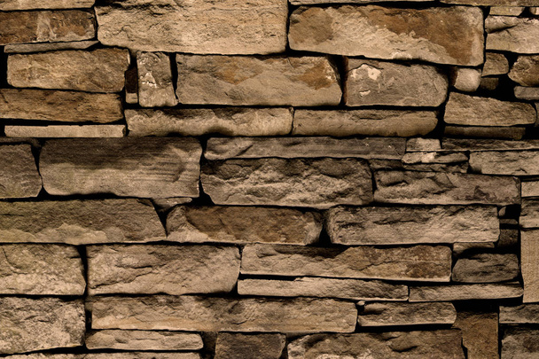 φυσικές πέτρες πέτρες τούβλα ψαμμίτες τοίχο ισόγειο επιφάνειας ταπετσαρία φόντο φόντο - Φωτογραφία, εικόνα