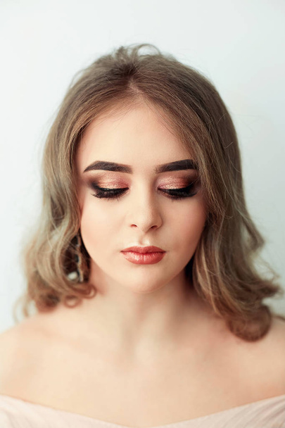 Beautiful model girl with Fashion Luxury Makeup, long eyelashes, perfect skin facial make-up. Beauty Brunette model woman holiday make up close up. Eyelash extensions, false eyelashes. Beauty Woman. - 写真・画像