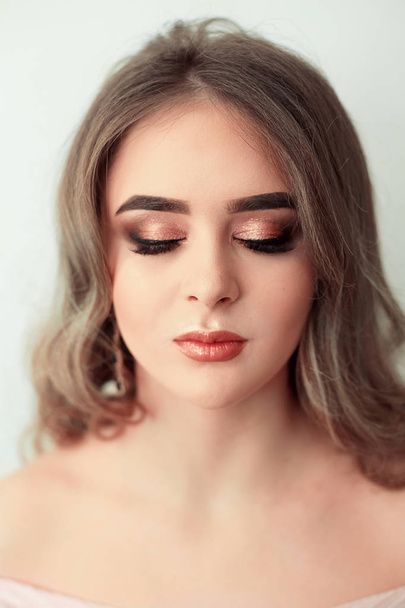 Beautiful model girl with Fashion Luxury Makeup, long eyelashes, perfect skin facial make-up. Beauty Brunette model woman holiday make up close up. Eyelash extensions, false eyelashes. Beauty Woman. - Fotoğraf, Görsel
