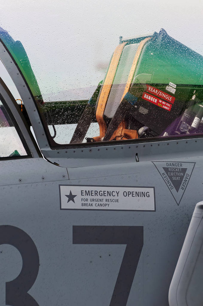 Closeup of ejection seat inside cockpit of modern military jet airplane. Military, airforce, avionics and defense concepts. - Photo, Image