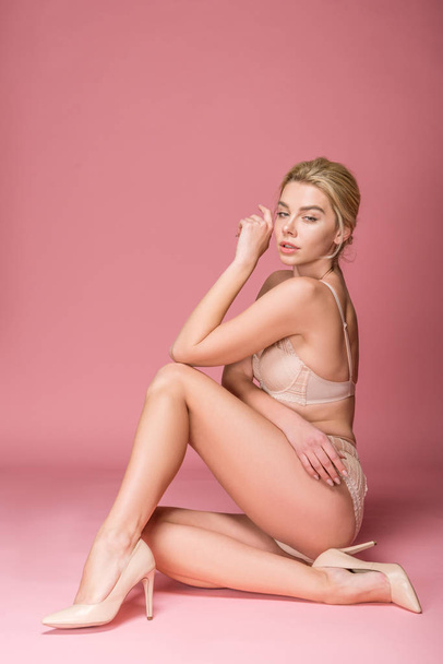 beautiful sexy girl posing in lingerie, isolated on pink - Foto, afbeelding