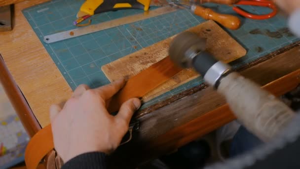 Skinner working with leather belt - Footage, Video