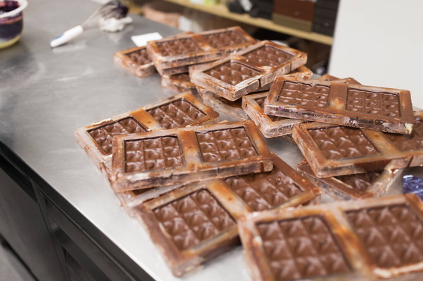 chocolate in candy molds at confectionery shop - Foto, Imagem
