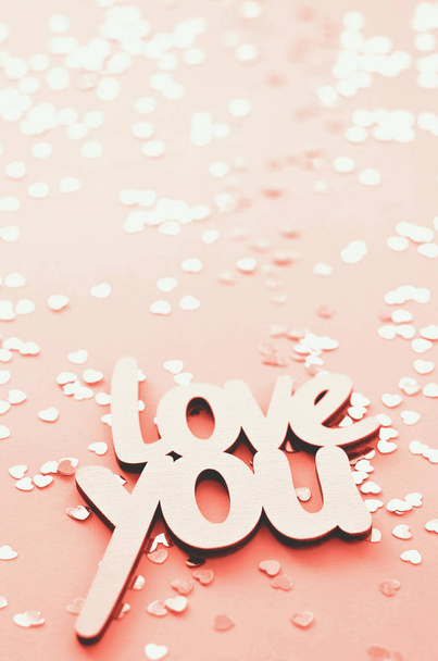 The word love you on a coral background with many hearts. Coral color is the fashionable color of the year. - Fotó, kép