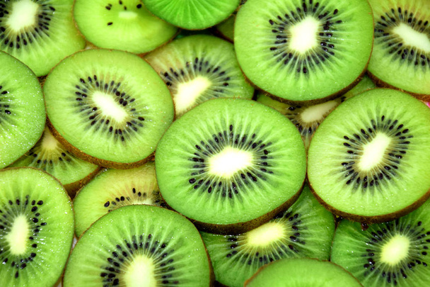 friss szelet kiwi fruit háttér - Fotó, kép