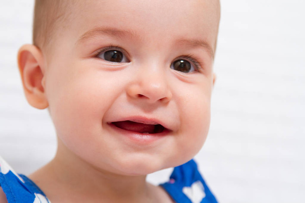 Closeup portrait of adorable smiling baby on white background - Φωτογραφία, εικόνα