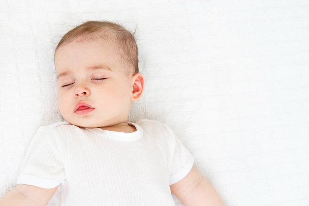 Beautiful sleeping baby on white background - Valokuva, kuva