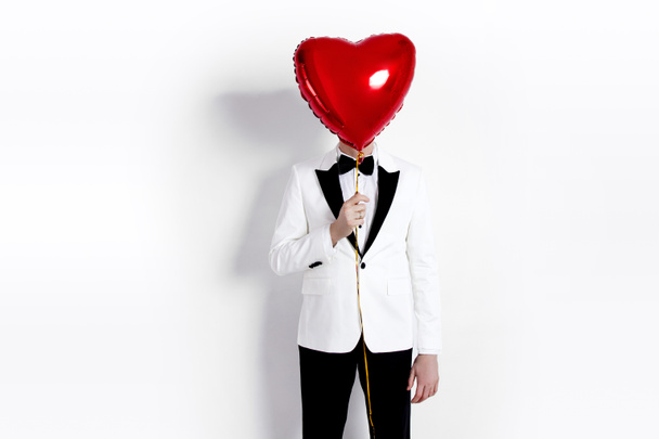 Valentine man. Handsome Boyfriend holding heart shaped air balloon. Happy Joyful man. Love. Happy Valentine's Day and wedding - Image - Photo, image