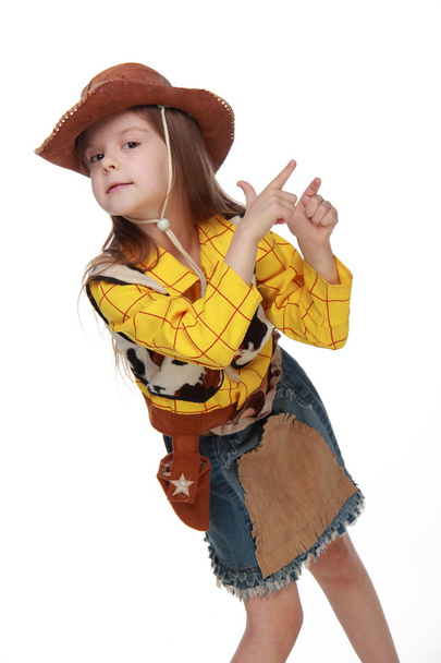 Beautiful little girl in a cowboy costume on white background - Fotoğraf, Görsel