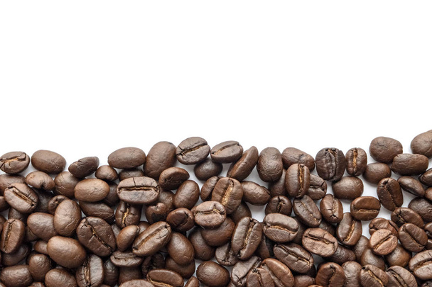 Roasted coffee beans on white background. Close-up image. - Φωτογραφία, εικόνα