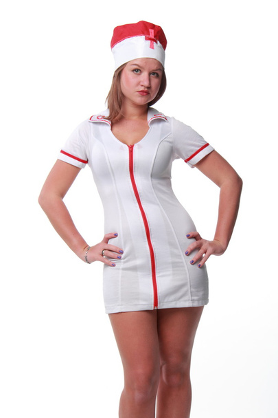 Young woman in sexy nurse costume on white background - Fotoğraf, Görsel