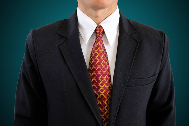 Handsome businessman in black suit on isolated background with clipping path. - Photo, Image