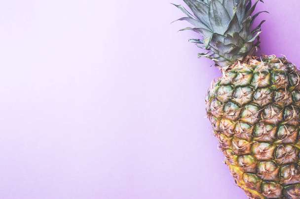 Ripe pineapple on a pink toned background. Copy space. - Fotografie, Obrázek