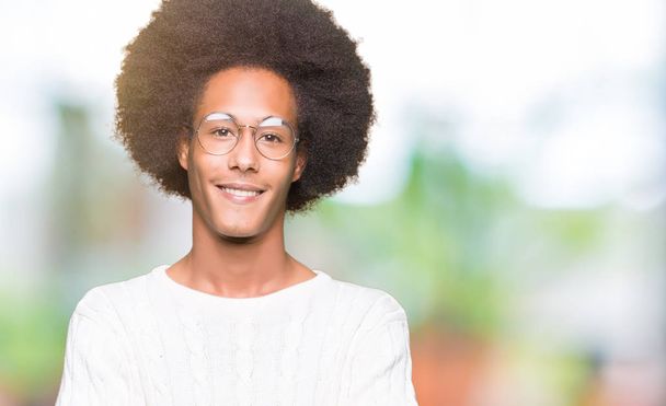 Young african american man with afro hair wearing glasses happy face smiling with crossed arms looking at the camera. Positive person. - Φωτογραφία, εικόνα