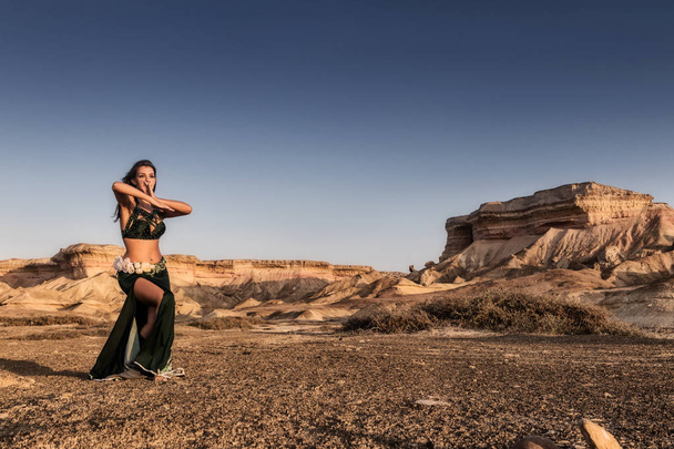 Active woman dancing on plain of the Namibe Desert. Africa. Angola. - Fotoğraf, Görsel