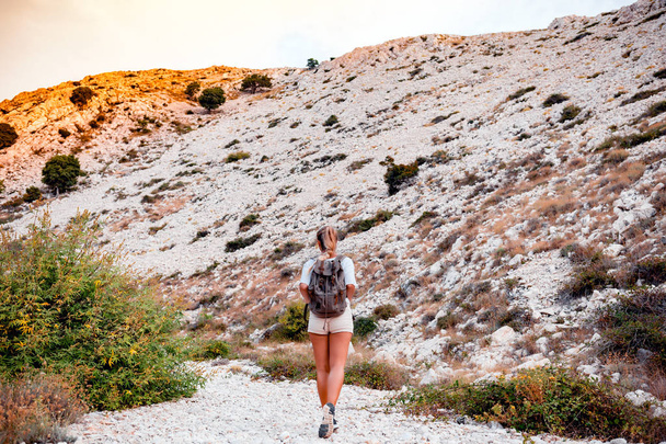 Hiker woman with backpack on trekking trail, travel and active lifestyle concept - Φωτογραφία, εικόνα