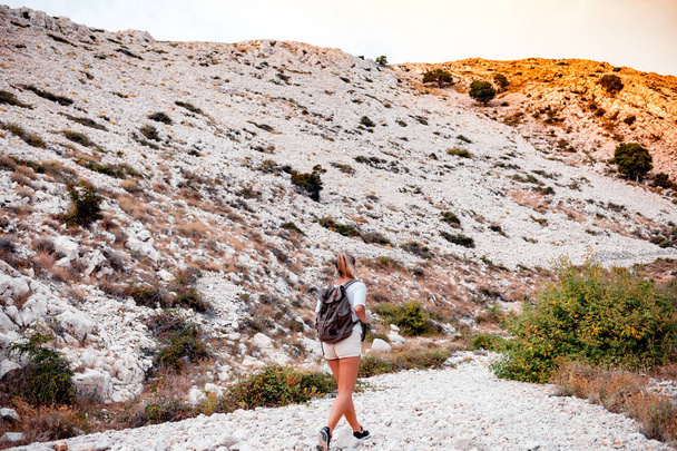 Hiker woman with backpack on trekking trail, travel and active lifestyle concept - Photo, Image