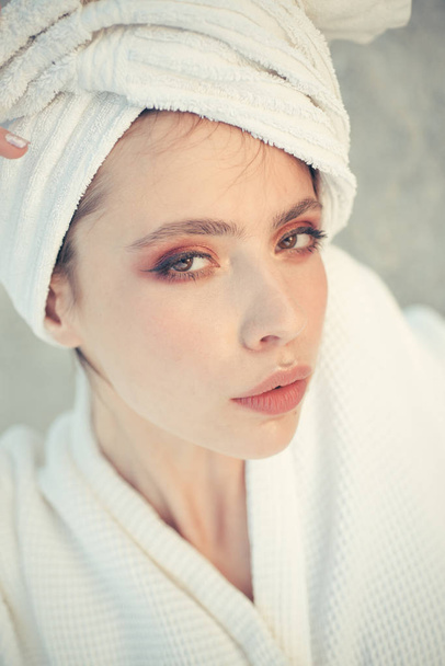 Her haircare routine. Beauty routine and hygiene care. Pretty woman wear bath towel on head. Young woman in bathing gown. Skincare model after spa bath. Skincare at spa. Beauty salon. Bathing habits - Фото, изображение