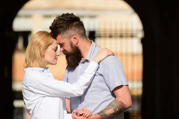Made to love each other. Loving couple of woman and hipster dating outdoor. Couple in love on summer day. Sensual woman and bearded man enjoy romantic date. Feeling love and romance - Фото, изображение
