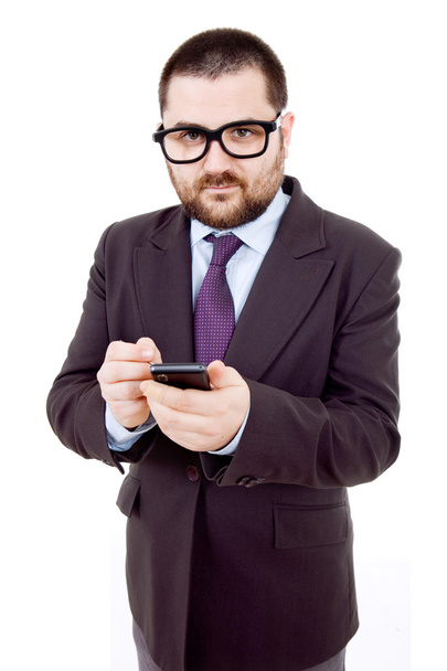 Молодой бизнесмен смотрит на свой телефон
 - Фото, изображение
