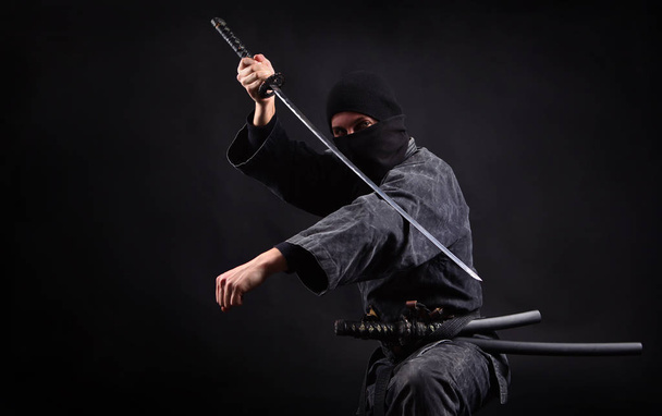 Ninja samurai with katana in attack pose - Zdjęcie, obraz