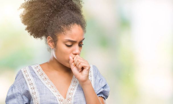Young afro american woman over isolated background feeling unwell and coughing as symptom for cold or bronchitis. Healthcare concept. - Fotografie, Obrázek
