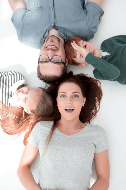 top view. happy parents with children to relax by lying on the f - Foto, Imagem