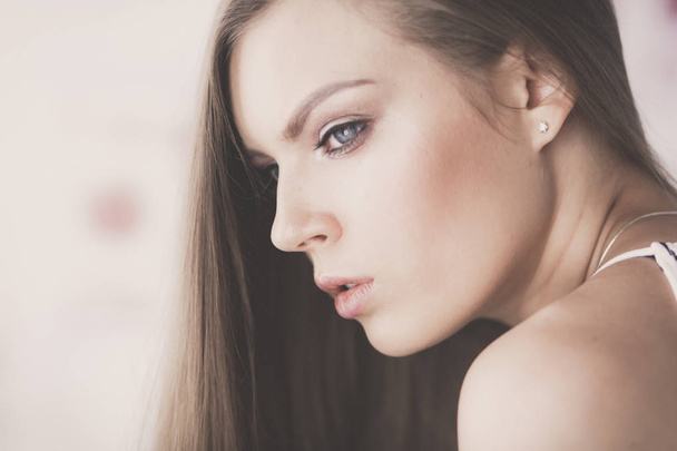 Beautiful woman face close up studio on white - Foto, Imagem