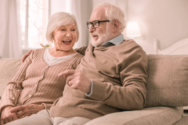 Pleased mature man speaking with his wife - Photo, Image