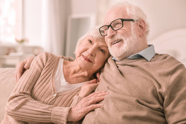 Pleased senior people having rest at home - Фото, изображение