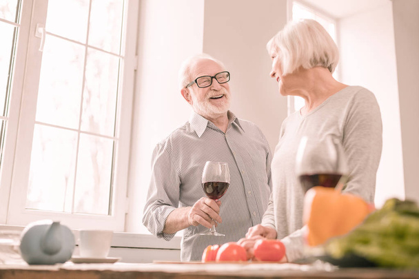 Positive delighted male person going to taste wine - Photo, Image