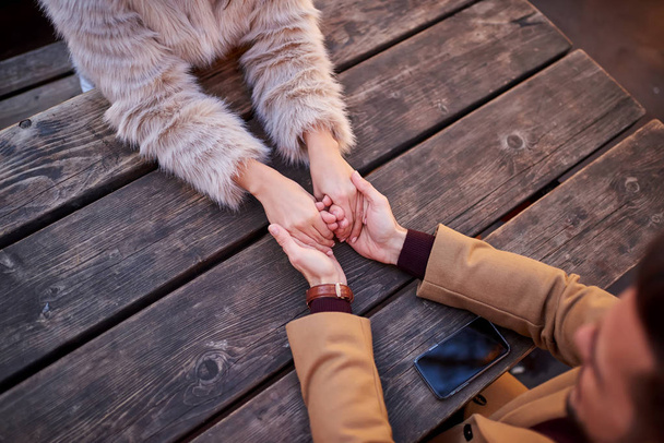 Holding hands in a christmas market - Foto, afbeelding