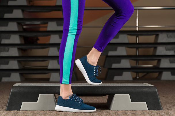 step platform. foot on step platform. classes in the gym. fitness aerobics. - Photo, Image
