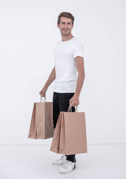Guy satisfied carries bag - Foto, imagen