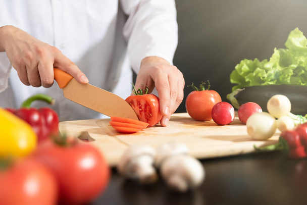 Chef prepares fresh vegetables. Cooking, healthy nutrition concept - Foto, immagini