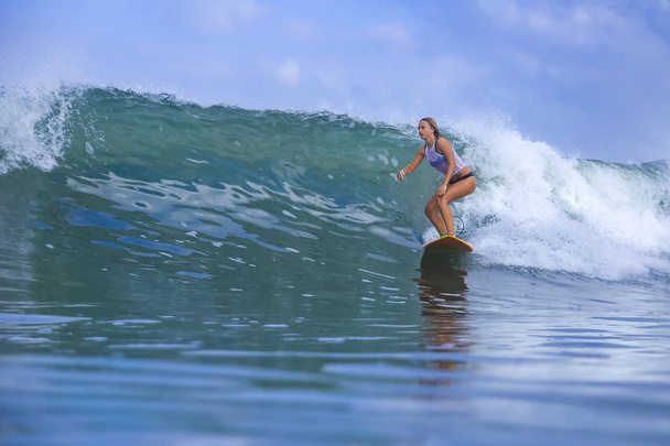 Young woman on blue wave - Foto, Imagem