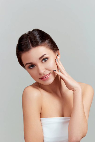 Skincare. Beauty Concept. Beautiful Young Woman with Clean Fresh Skin.  Young pretty female of  Smiling With Natural Makeup. Beauty Girl face  care. Moisturizer Facial treatment.Cosmetology.Beauty and Spa. - Fotoğraf, Görsel