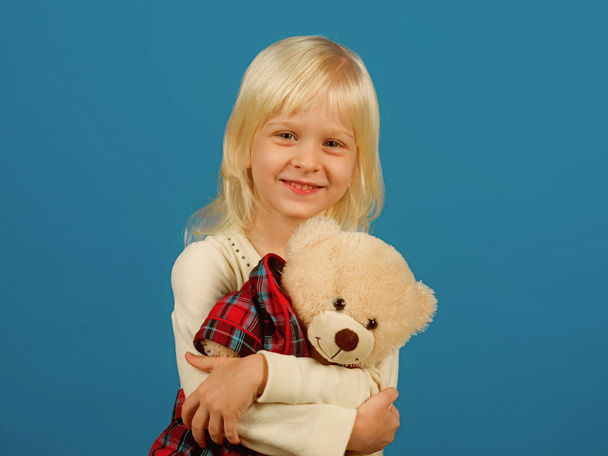 Cuddly toy. Small kid happy smiling. Happy childhood. My favorite childhood toy. Little girl with teddy bear. Small girl hold toy bear. Little child with soft toy - Foto, Bild