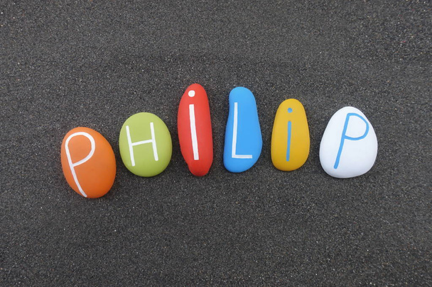 Philip, masculine given name composed with colored stones over black volcanic sand - Photo, Image
