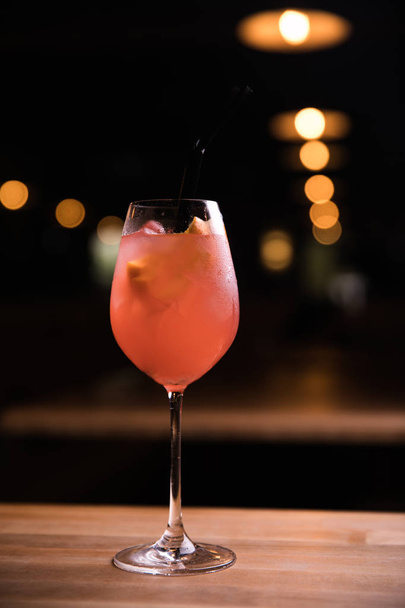 Fresh cocktail on a black background. Alcoholic cocktail on a black background. Fruit with a cocktail. Non-alcoholic cocktail. - 写真・画像
