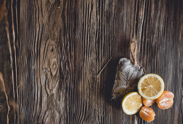 Different ripe citrus on wooden background - Φωτογραφία, εικόνα