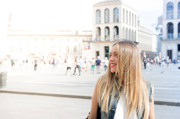 Pretty millennial teenager tourist visiting the city of Milan, in Italy - Foto, Imagem