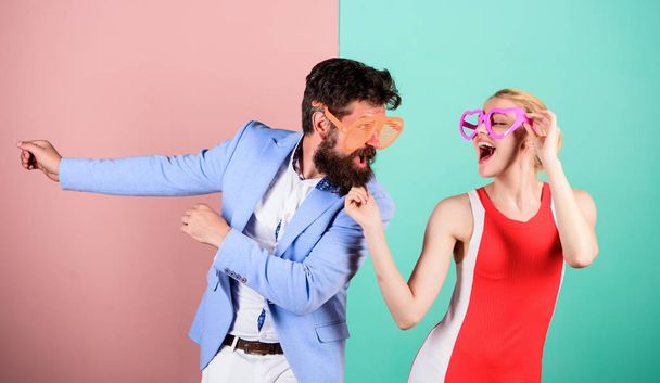 Frienship of happy man and woman. Hipster. Happy couple in party - 写真・画像